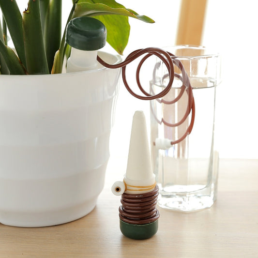 Automatic watering spike with dark cap and brown coiled tube