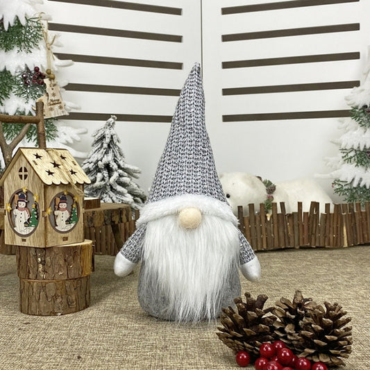 Grey knitted gnome decoration with white beard and beige nose ball
