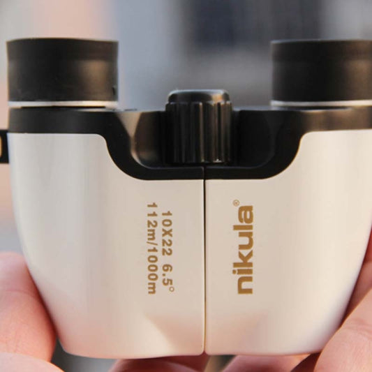 Low-light binoculars front view, white housing with central focus wheel