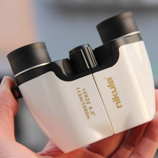 Low-light binoculars, white body with black eyepieces and NIKULA branding