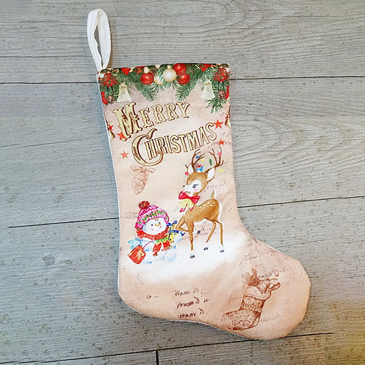 Beige Christmas stocking with 'Merry Christmas' and deer illustration with snow figures.