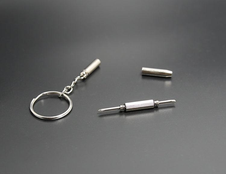 Mini keychain screwdriver parts: key ring, two silver bit tips, small cap