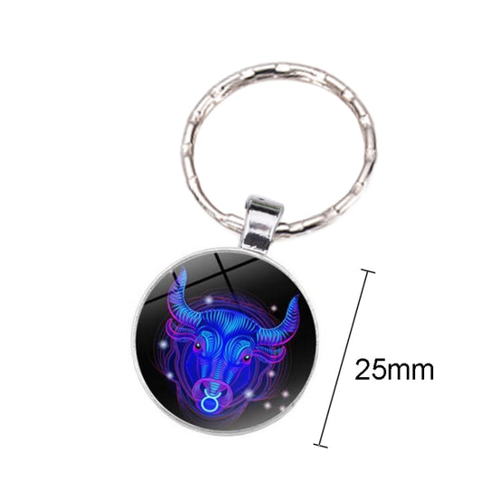 Silver-tone keyring with 25mm round pendant and blue glowing bull artwork, single-sided.