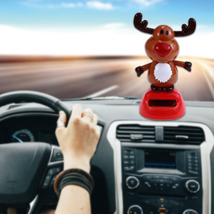 Reindeer solar dashboard decoration with brown antlers and red base