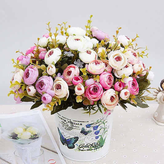 Artificial tea rose bridal bouquet with pink and white roses, green foliage, and yellow buds