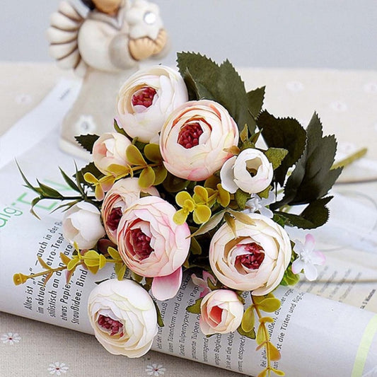 Artificial tea rose bridal bouquet with pink, red, and white flowers and green leaves