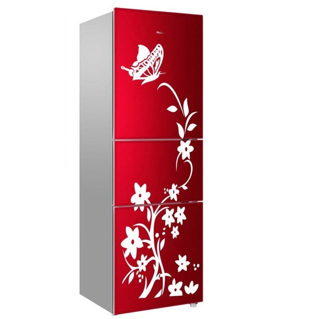White floral bird refrigerator sticker with leaves and blossoms on a red three-door fridge.
