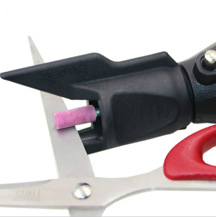Black grinding chamfering accessory with pink abrasive wheel attached to blade arm