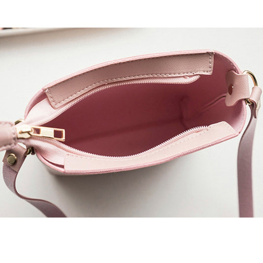 Pink crossbody zipper bag, open top view showing interior lining and side pocket