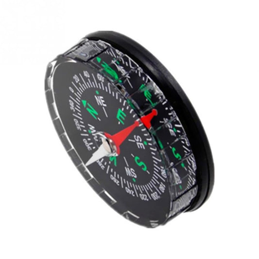 Black side view mini compass showing red needle, compass dial with green N/E/S letters