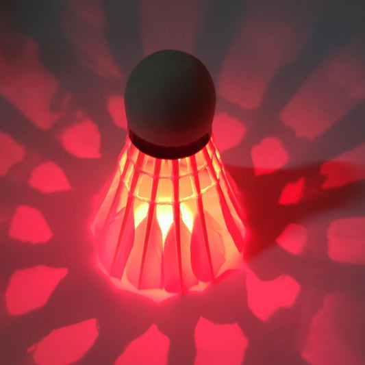 LED shuttlecock with red glowing feathers and black head