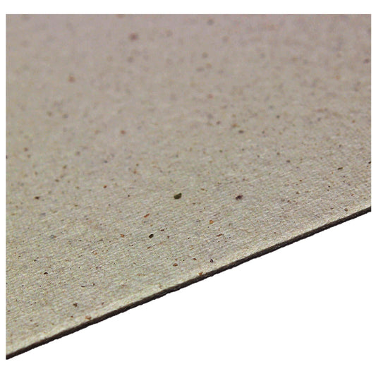 Microwave oven mica sheet edge close-up, tan speckled texture