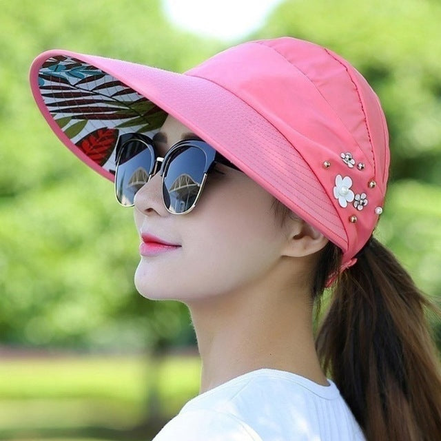 Foldable sun block hat, pink with floral pins and wide brim