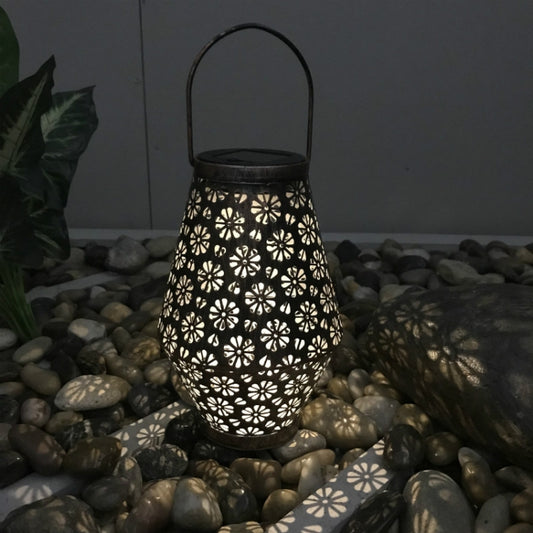 Brown wrought-iron solar lantern with cutout chrysanthemum floral pattern and handle