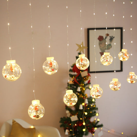 Warm white LED globe curtain lights with clear spherical bulbs on thin hanging wires
