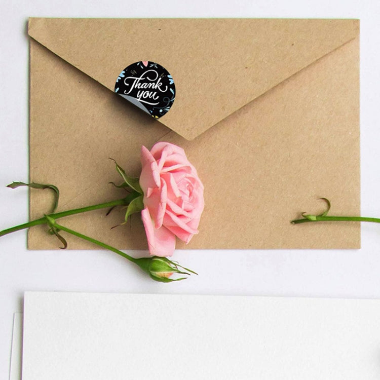 Round thank you seal sticker on kraft envelope, black design with red heart