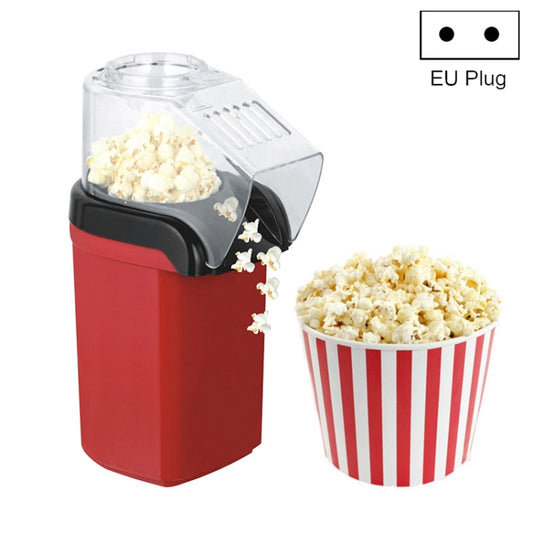 Red electric countertop popcorn machine with transparent top and side black housing
