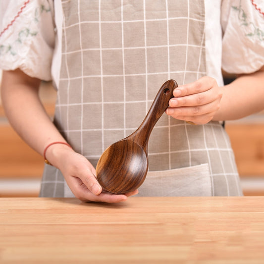 Wooden cooking spoon with teardrop bowl and long handle, dark teak brown finish
