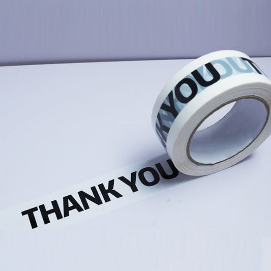 White packing sealing tape with black “THANK YOU” text, on a roll.