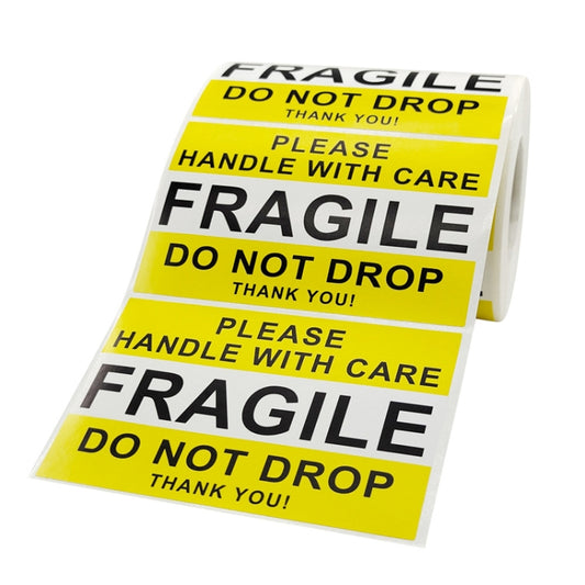 Fragile warning sticker label roll with yellow “HANDLE WITH CARE” and “DO NOT DROP”