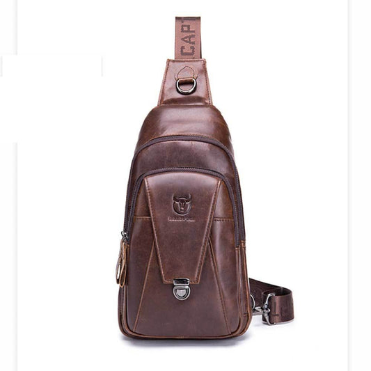 Men's leather chest bag in brown with front zipper, logo patch, and top loop handle