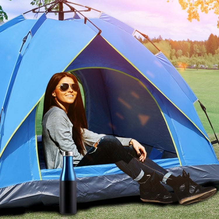 Blue automatic camping tent with open doorway, green trim and side panels