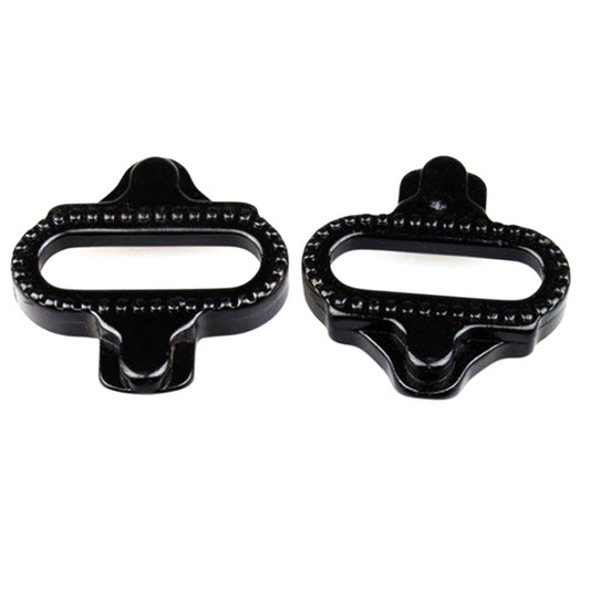 Pair of black cleat plates with oval opening and textured edges for pedals