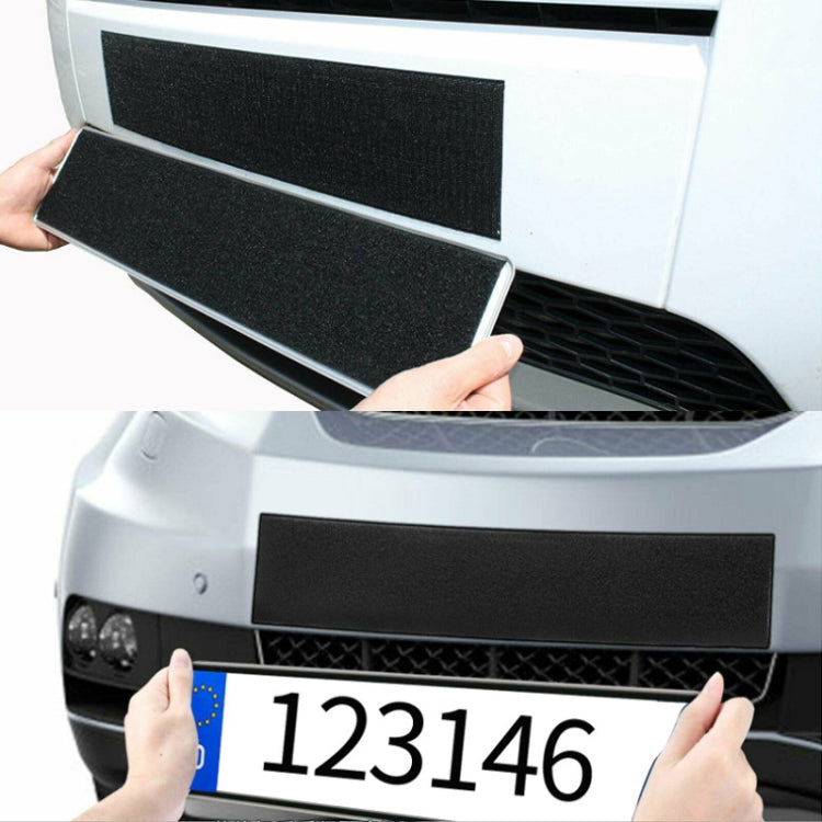 Black hook-and-loop fastener strip applied to a car front grille area