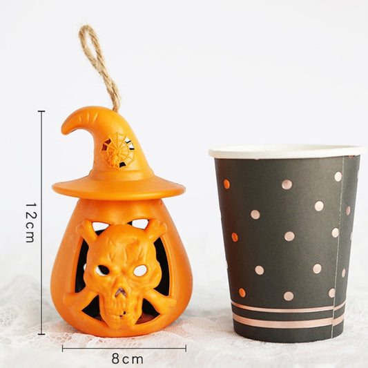 Orange pumpkin lantern ornament with witch hat and carved jack-o-lantern face cutouts