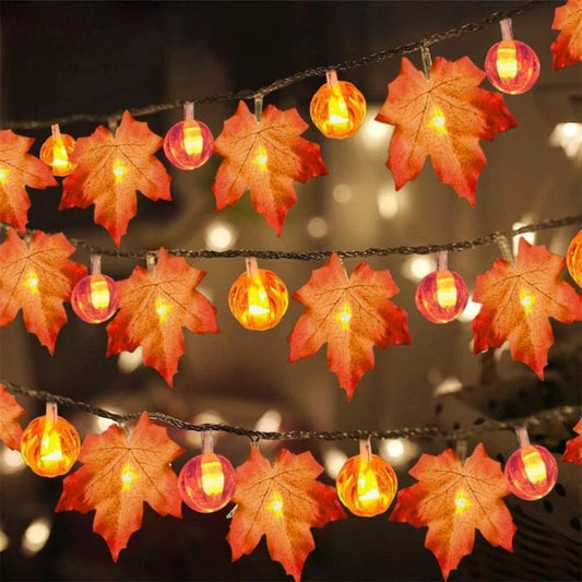 Maple leaf and pumpkin lantern string lights, warm amber LED bulbs on cord