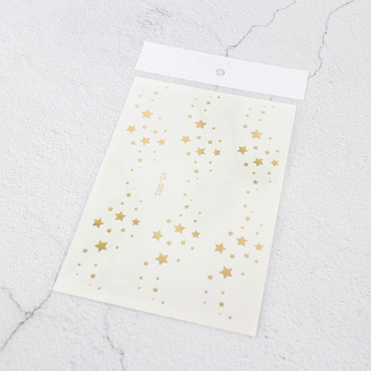 Gold star face tattoo sticker sheet on white backing, waterproof hot stamping