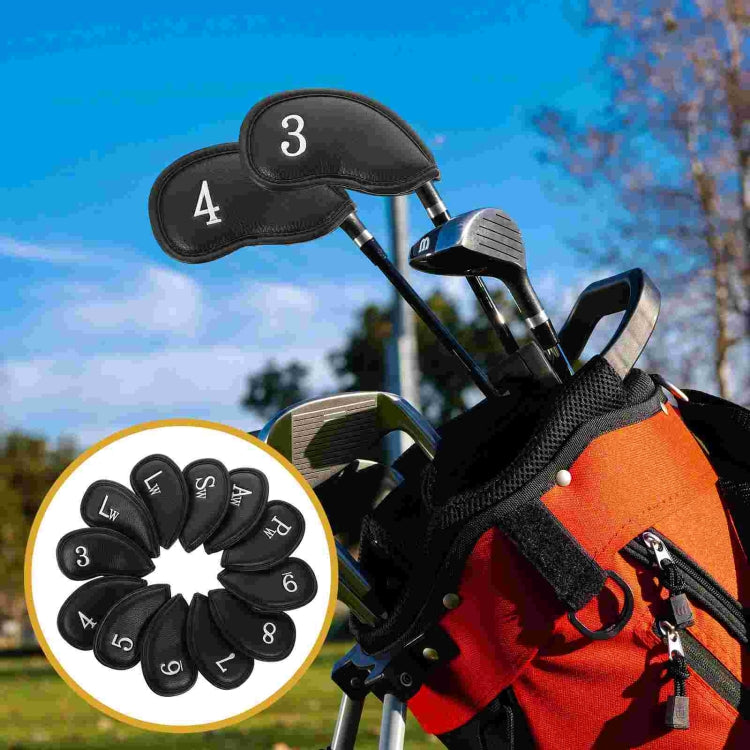 Golf bag with black numbered head covers on the club irons