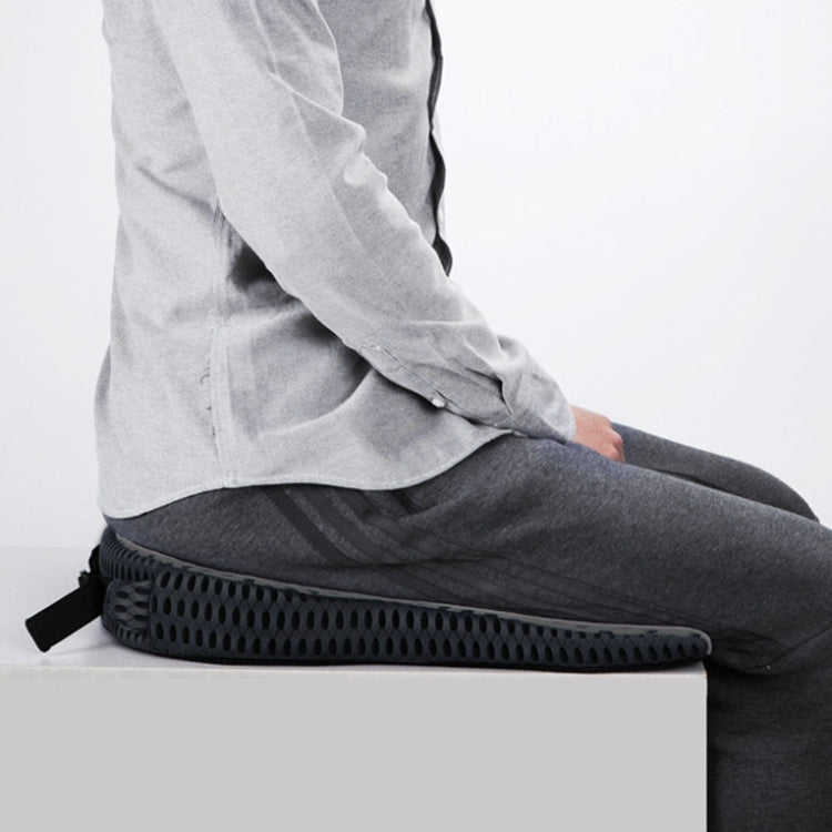 Black car seat cushion with adjustable strap and breathable mesh top on seat
