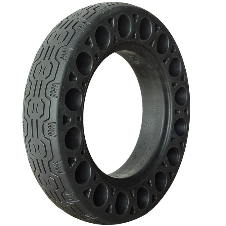Black rubber solid tire with spoked cutout rim and tread pattern