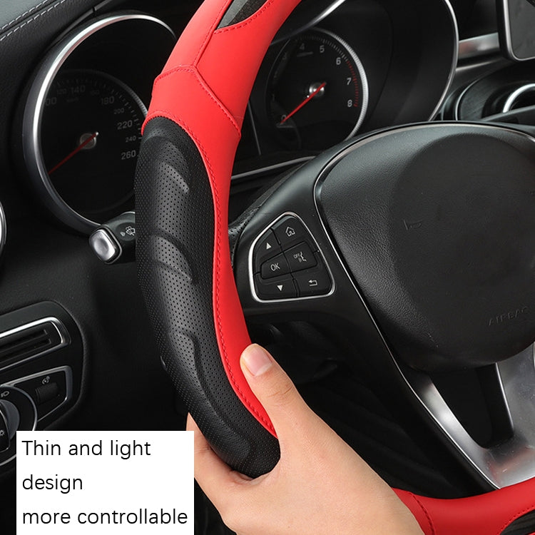 Red and black perforated steering wheel cover with stitched grip section