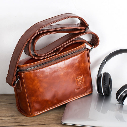 Brown leather shoulder messenger bag with front zip pocket and adjustable strap