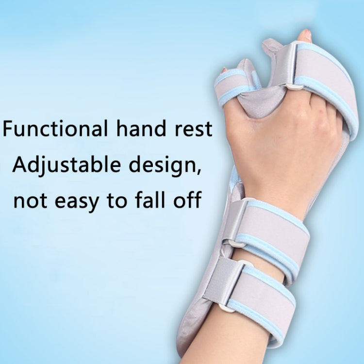 Gray wrist splint with blue adjustable wrap straps holding hand in place