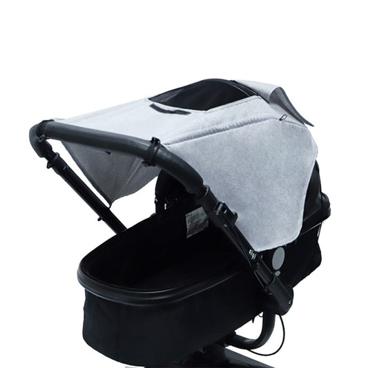 Gray stroller sunshade cover with visible sunroof window and dark trim