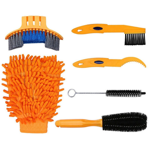 Bike chain cleaner kit set with orange gloves and multiple brushes plus chain cleaning tool