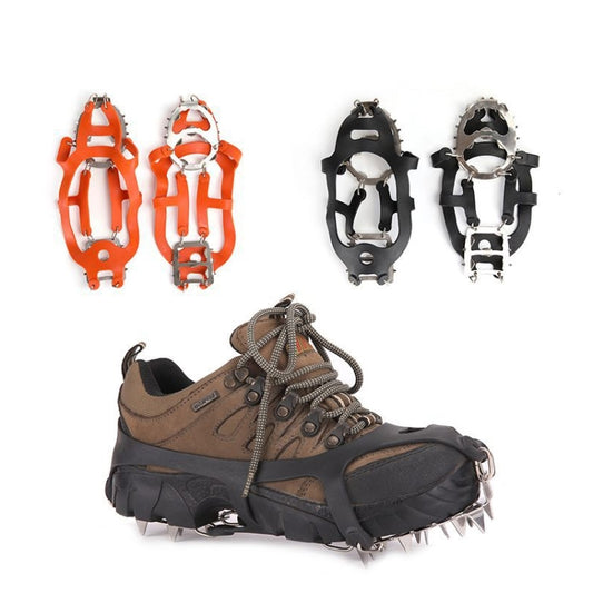Orange and black ice crampons with steel spikes, shown as a left and right pair