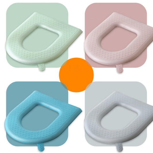 Multicolor toilet seat covers in green, pink, blue, and gray with oval openings