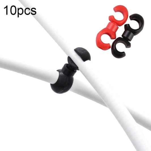 Bicycle shift cable buckle clips on white cable, red and black locking pieces