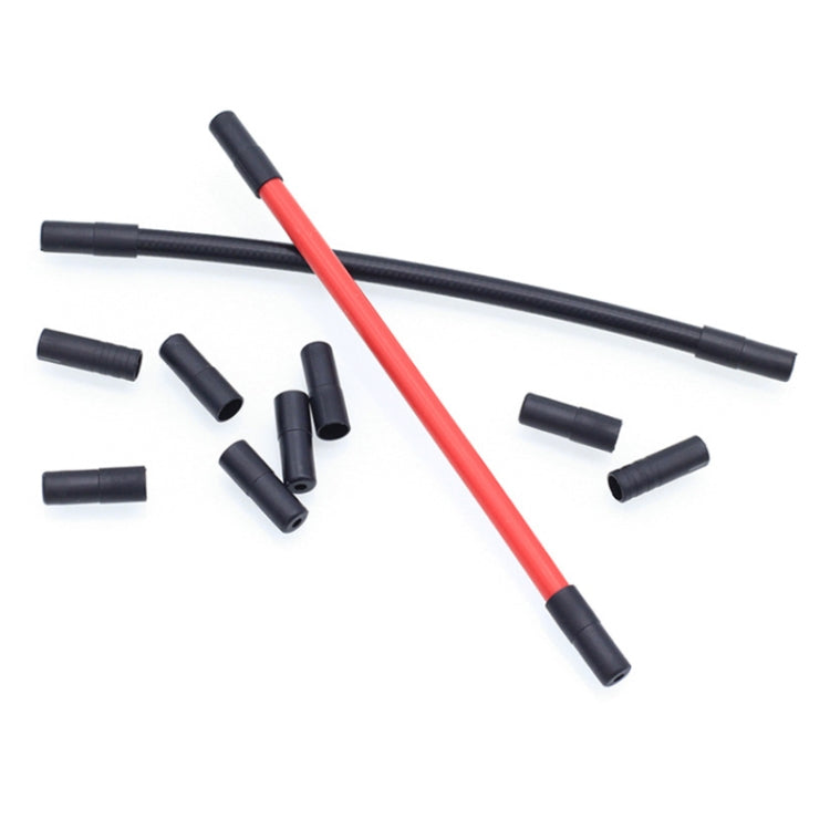 Red and black bike cable housings with black plastic end caps plus loose caps