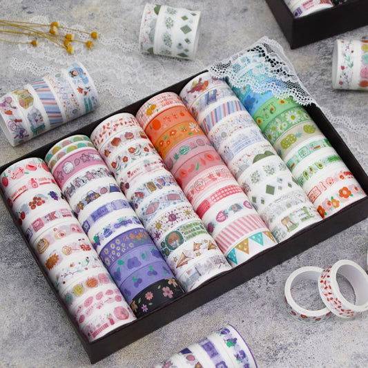 Cartoon-pattern washi tape set with multiple colorful rolls in a black box
