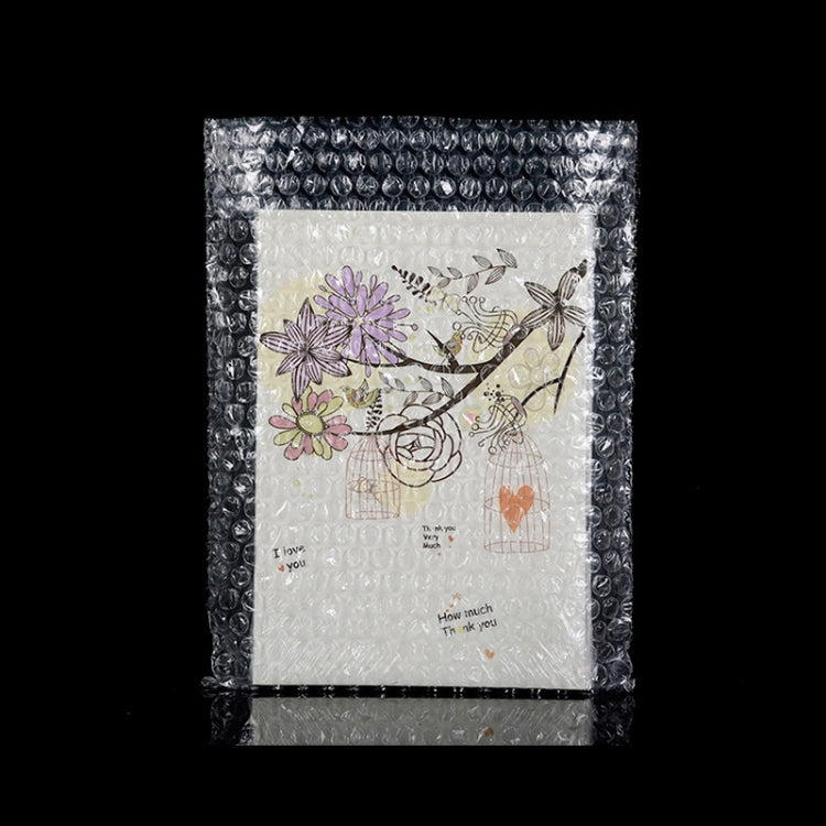 Clear bubble mailer envelope with a floral card inside, wrapped for shipping