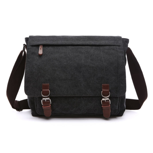 Charcoal gray canvas messenger bag with flap, front buckle closures, and adjustable strap.