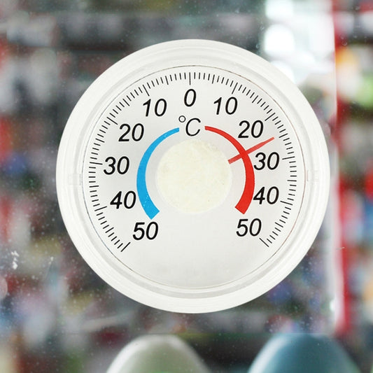 Round plastic thermometer with °C scale and blue/red temperature indicator arcs