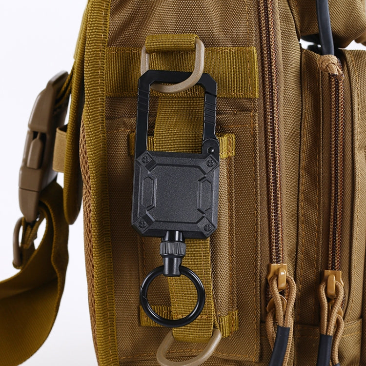Black magnetic keychain lanyard clip attached to tan backpack strap with key ring