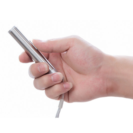 Silver rechargeable flashlight pen held in a hand, front lens opening visible.