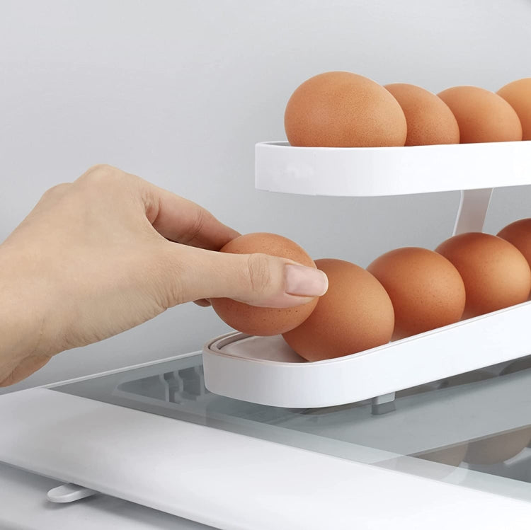White egg dispenser tray with rolling track, showing a hand placing an egg